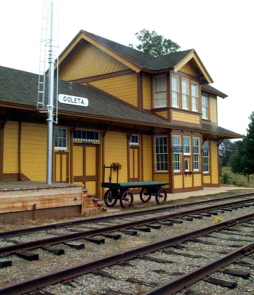 Historic Goleta railroad station with mustard yellow siding and brown trim