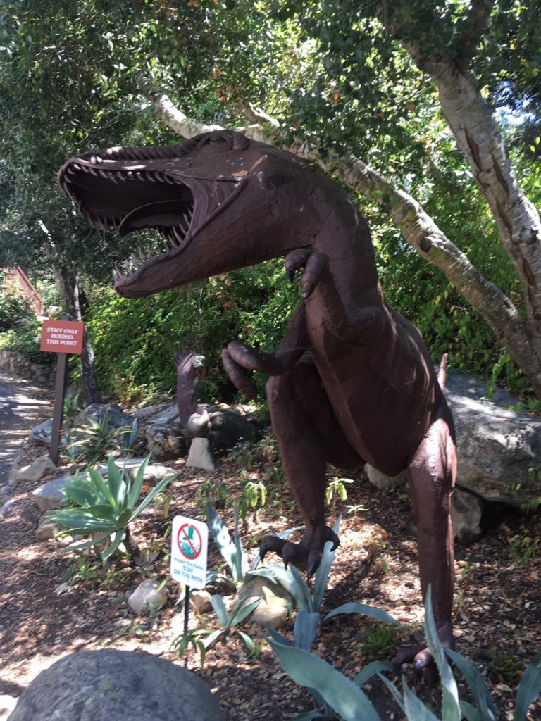 bronze statue of roaring dinosaur outside at the Santa Barbara Museum of Natural History