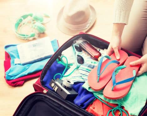 Woman packing suitcase