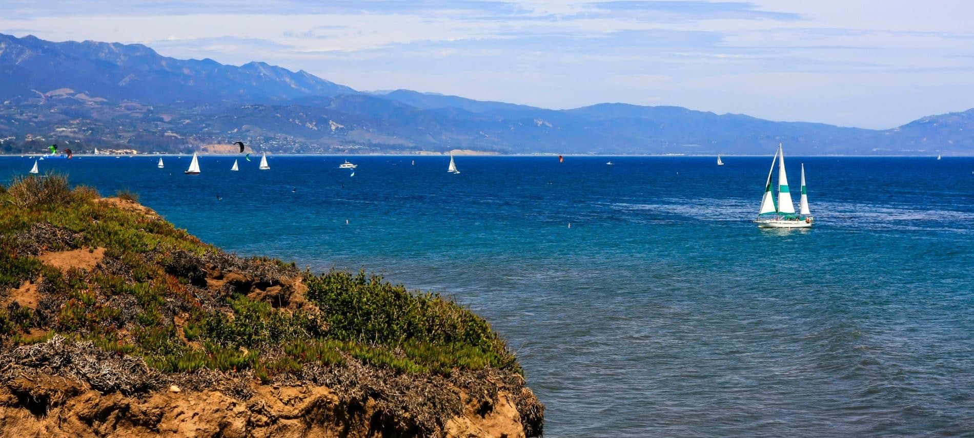 View of sailboats in the ocean from the cliffs of Shoreline Park in Santa Barbara