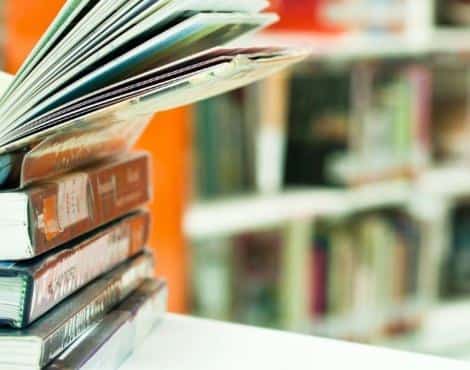 Close up view of a stack of books in a library