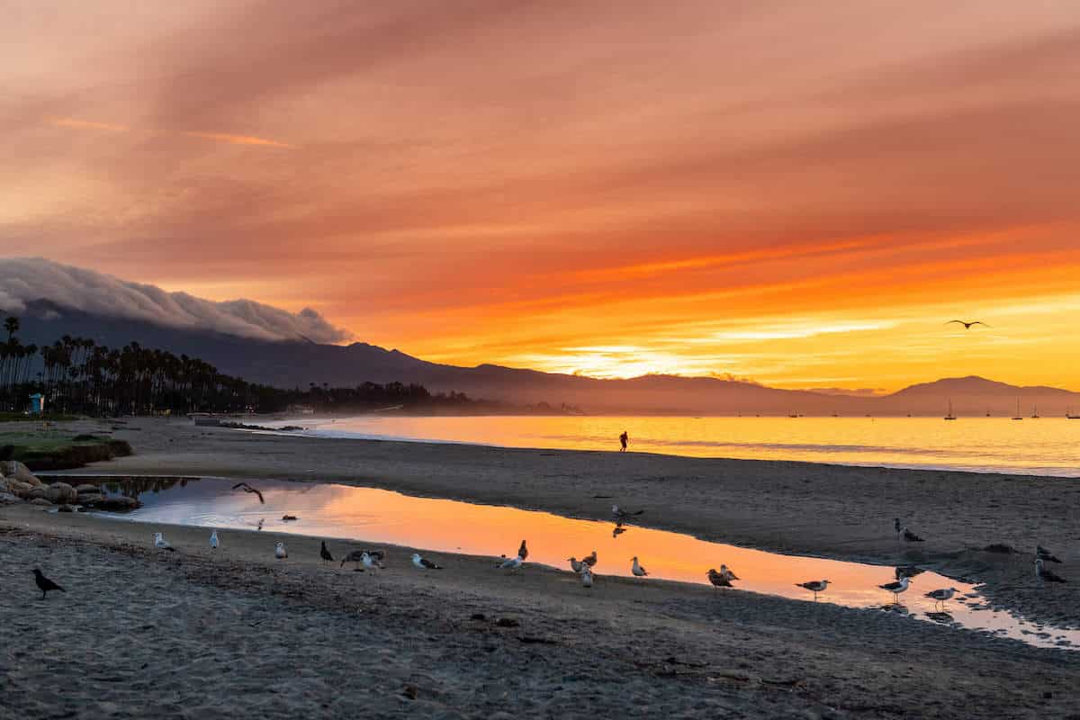Brilliant red, orange, yellow sunset over the water in Santa Barbara