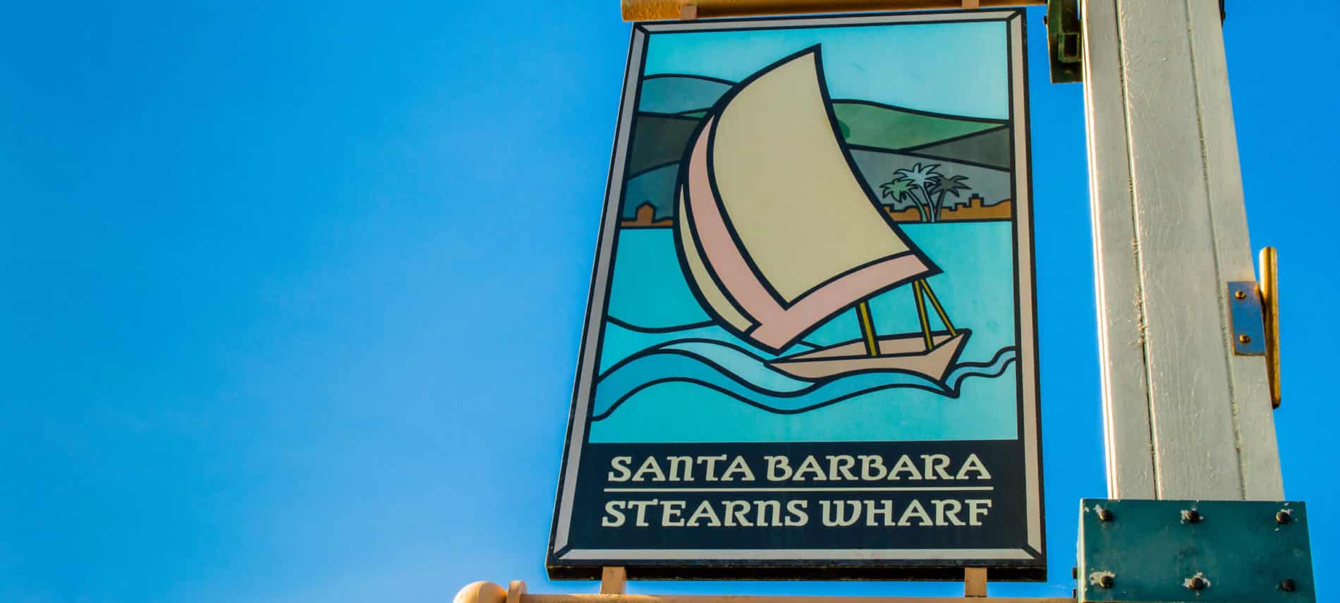 Santa Barbara's Stearns Wharf sign post amidst a brillian blue sky